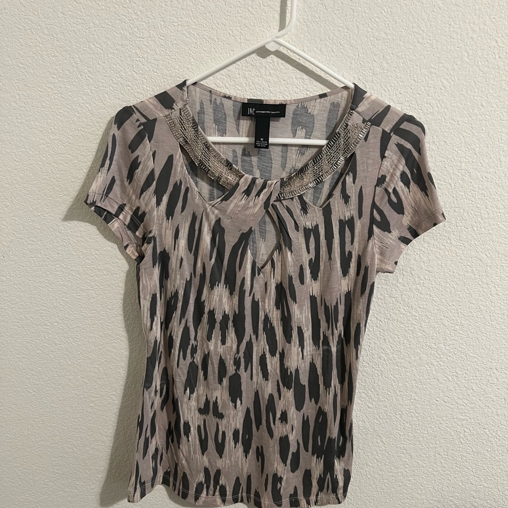 INC Beaded Top with peekaboo neck. Abstract animal print. Size M